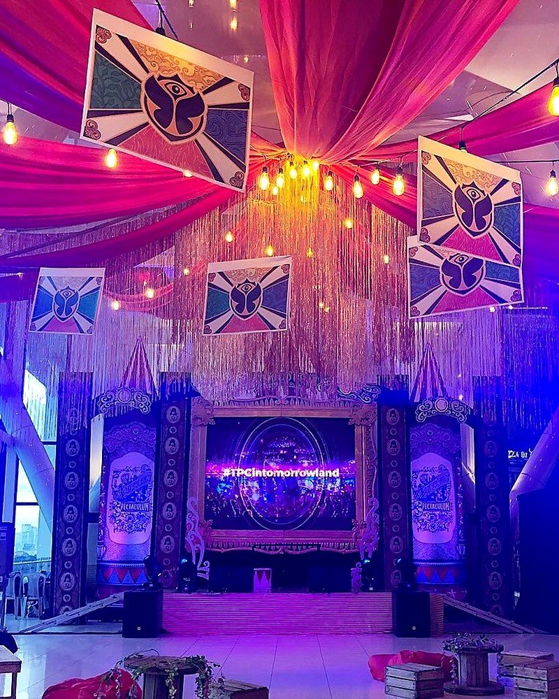 Tomorrowland-themed corporate event stage styled by Twinsome Events